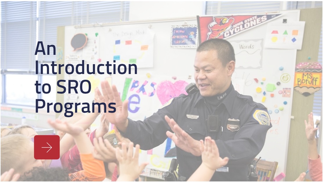 Title slide from the course An Introduction to SRO Programs with an officer in a classroom giving students high fives.